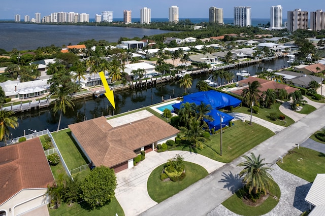 birds eye view of property with a water view