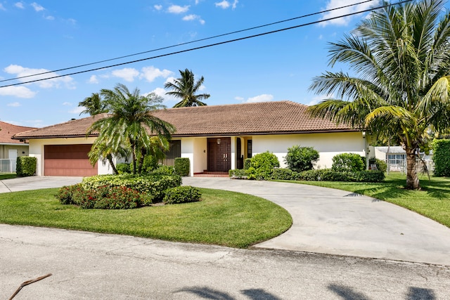 view of front facade with a front lawn and a garage