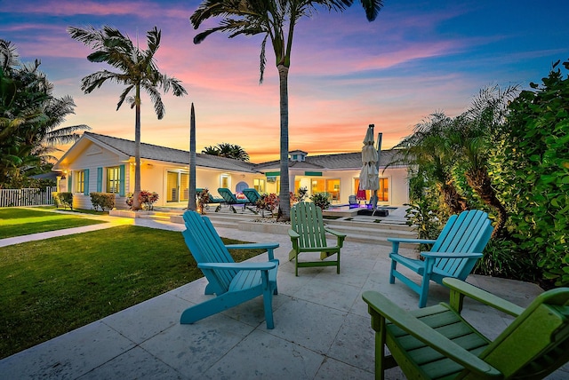 patio terrace at dusk with a lawn