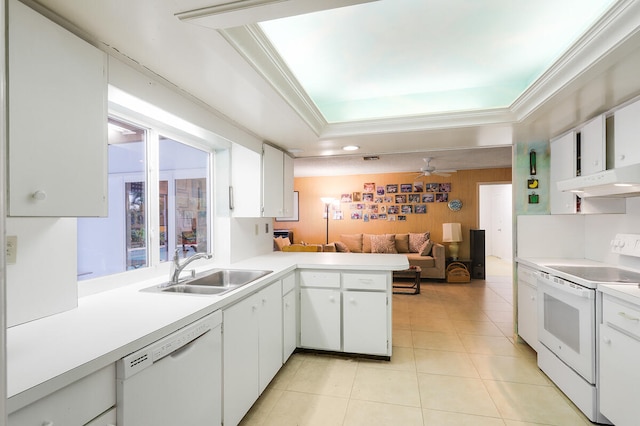 kitchen with white appliances, sink, kitchen peninsula, and white cabinets