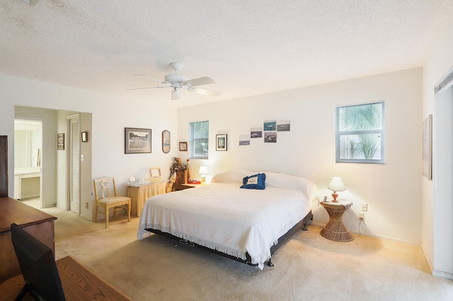 carpeted bedroom featuring a textured ceiling, radiator, and ceiling fan