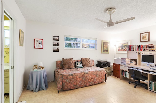 office area featuring a textured ceiling and ceiling fan