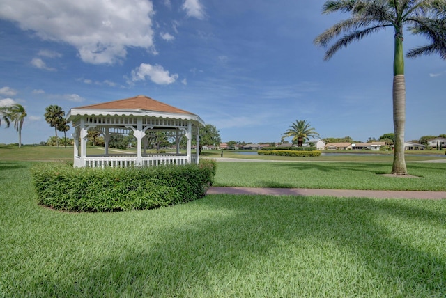 surrounding community with a yard and a gazebo