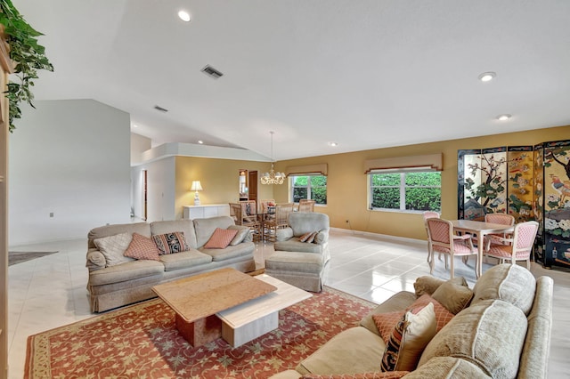 living room with lofted ceiling, light tile patterned flooring, and an inviting chandelier