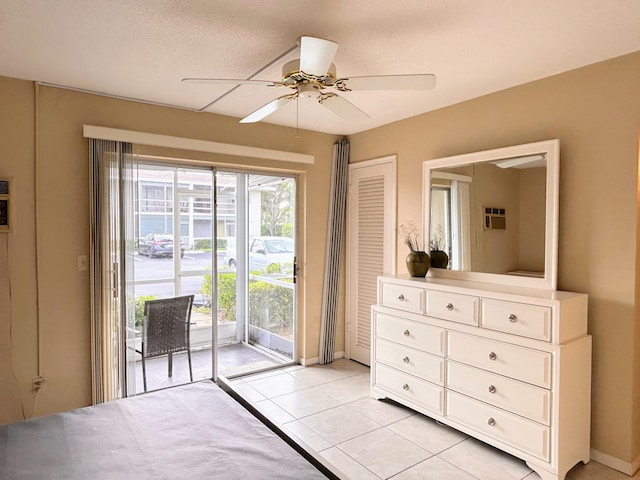 bedroom with ceiling fan, a textured ceiling, access to outside, and light tile patterned floors