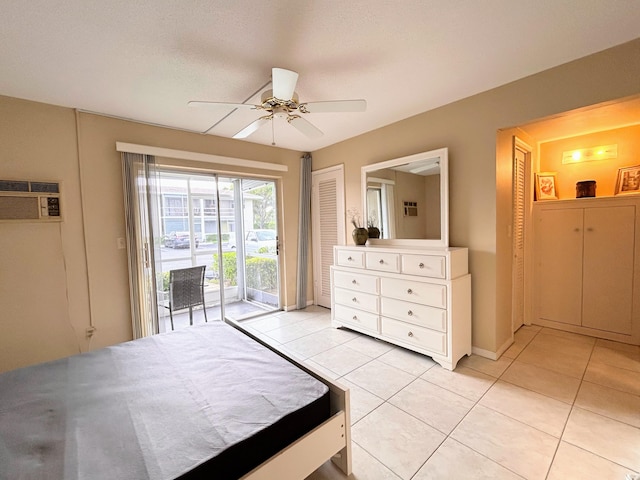 bedroom with access to outside, a closet, ceiling fan, a wall mounted AC, and light tile patterned floors