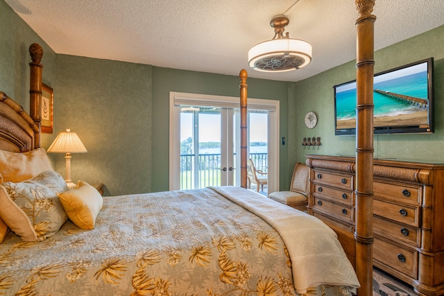 bedroom featuring access to exterior and a textured ceiling