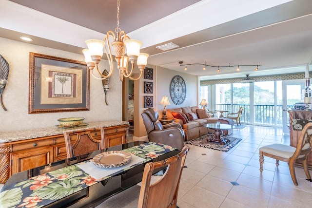 tiled dining area with crown molding and a notable chandelier