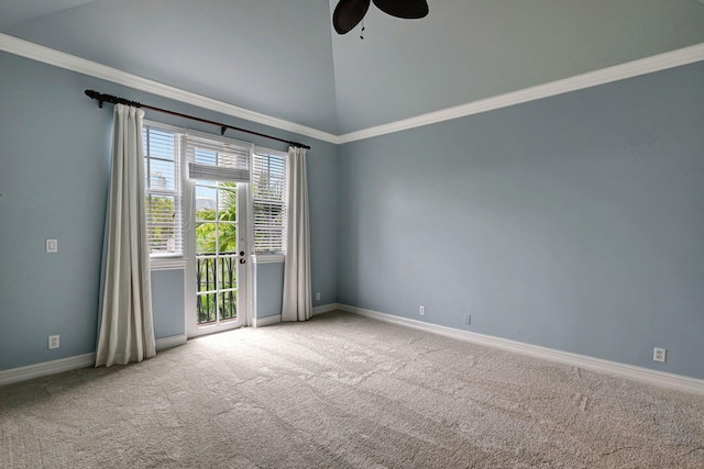 carpeted spare room featuring ceiling fan, crown molding, and vaulted ceiling