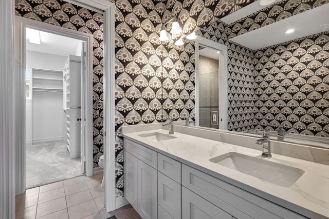 bathroom featuring tile patterned flooring and vanity