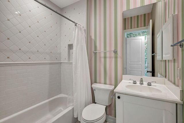 full bathroom with vanity, toilet, and shower / tub combo with curtain