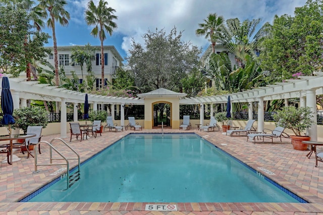 view of swimming pool featuring a patio area and a pergola