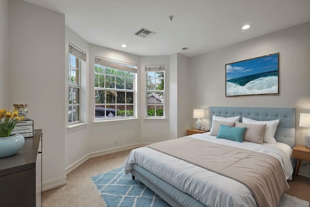 bedroom featuring light carpet