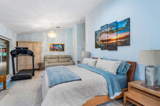 bedroom featuring a notable chandelier and wood-type flooring