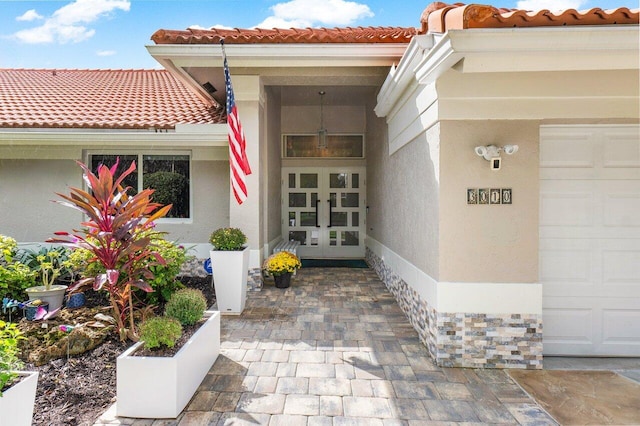 entrance to property featuring french doors