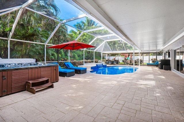 view of swimming pool with a hot tub, a patio area, and glass enclosure