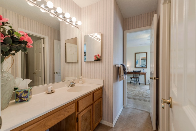 bathroom with vanity and a textured ceiling