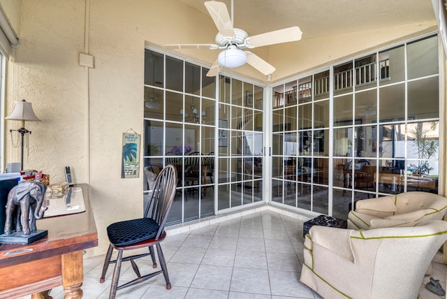 interior space featuring ceiling fan and lofted ceiling