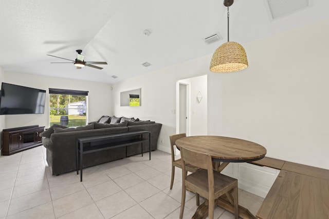 tiled living room with ceiling fan