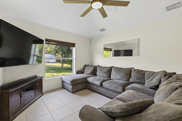 living room featuring light tile patterned floors and ceiling fan