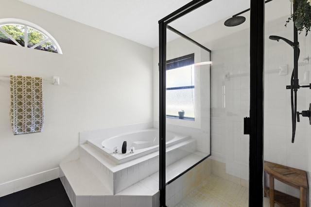 bathroom featuring tile patterned floors and separate shower and tub