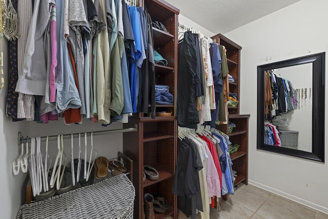 walk in closet featuring light tile patterned floors