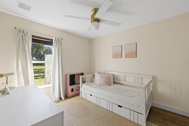 bedroom featuring ceiling fan and hardwood / wood-style floors