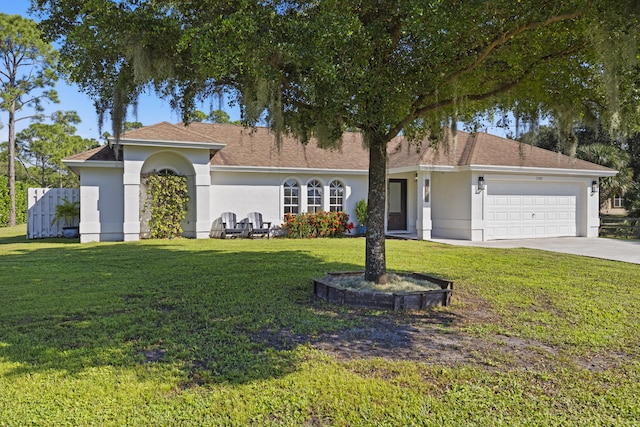 ranch-style home with a front lawn and a garage