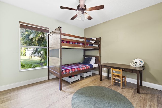 bedroom featuring wood-type flooring and ceiling fan