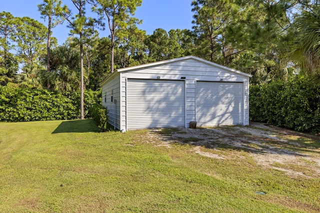 garage featuring a yard