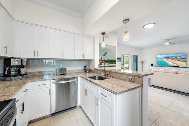 kitchen with white cabinetry, sink, hanging light fixtures, kitchen peninsula, and appliances with stainless steel finishes