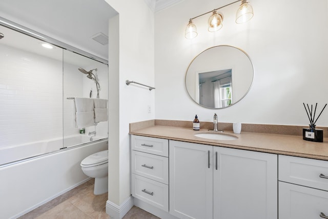 full bathroom with shower / bath combination with glass door, tile patterned floors, vanity, and toilet