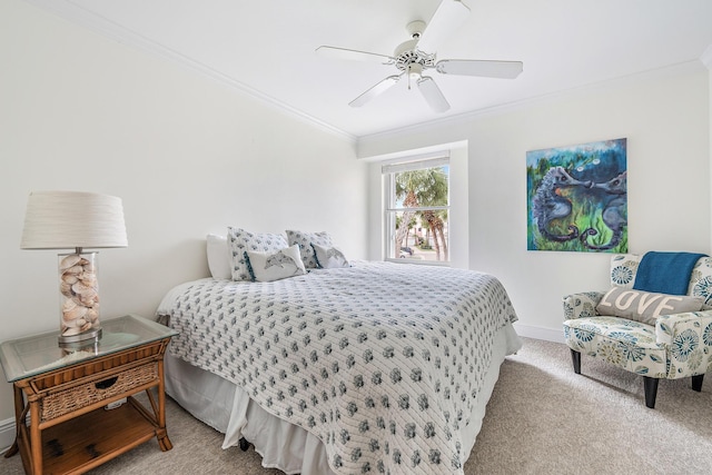 carpeted bedroom with ceiling fan and ornamental molding