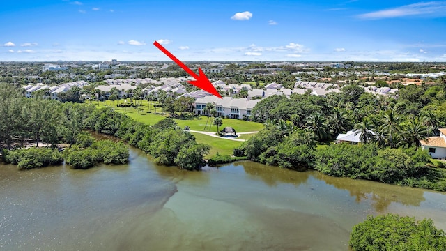 birds eye view of property with a water view