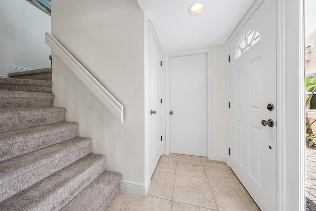 foyer entrance featuring light tile patterned floors