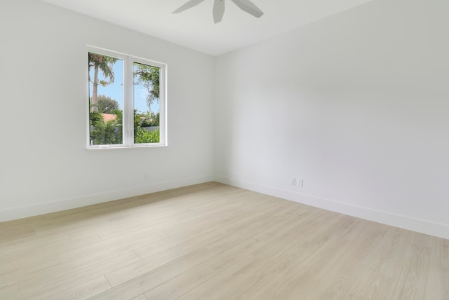 spare room featuring ceiling fan and light hardwood / wood-style flooring