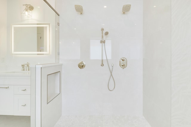 interior details featuring walk in shower and vanity