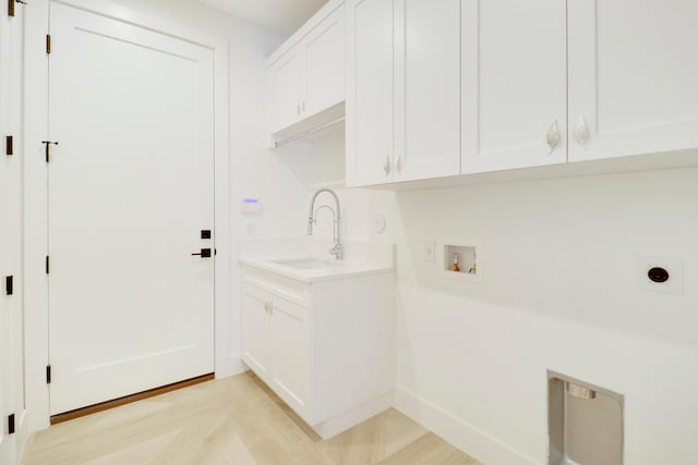 laundry area featuring cabinets, hookup for an electric dryer, washer hookup, and sink