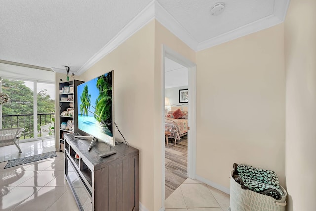 interior space featuring a textured ceiling and crown molding