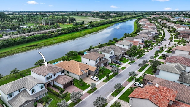 drone / aerial view featuring a water view