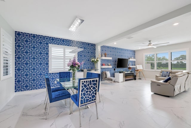 dining space with beamed ceiling and ceiling fan