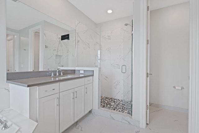 bathroom with vanity and walk in shower