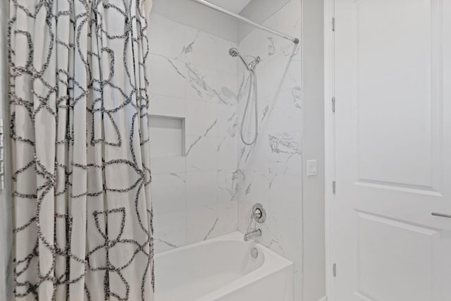 bathroom with shower / tub combo