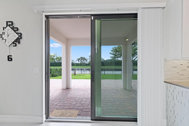 doorway featuring a water view