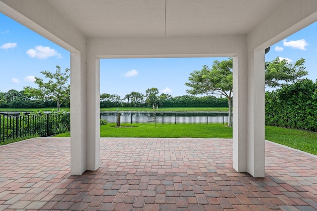 view of patio featuring a water view