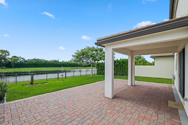 view of patio / terrace with a water view