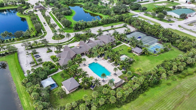 birds eye view of property with a water view