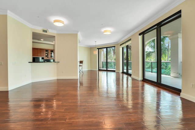 unfurnished living room featuring dark hardwood / wood-style floors and ornamental molding