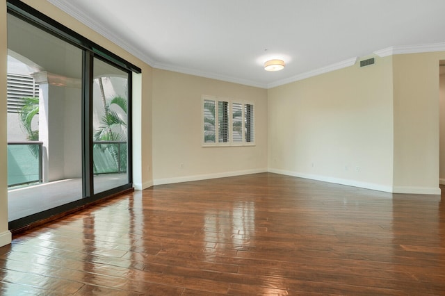 unfurnished room featuring dark hardwood / wood-style floors, plenty of natural light, and crown molding