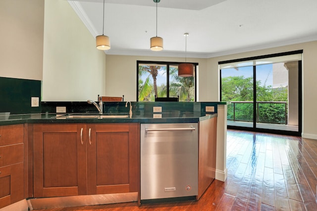 kitchen with crown molding, dark wood-type flooring, sink, dishwasher, and hanging light fixtures